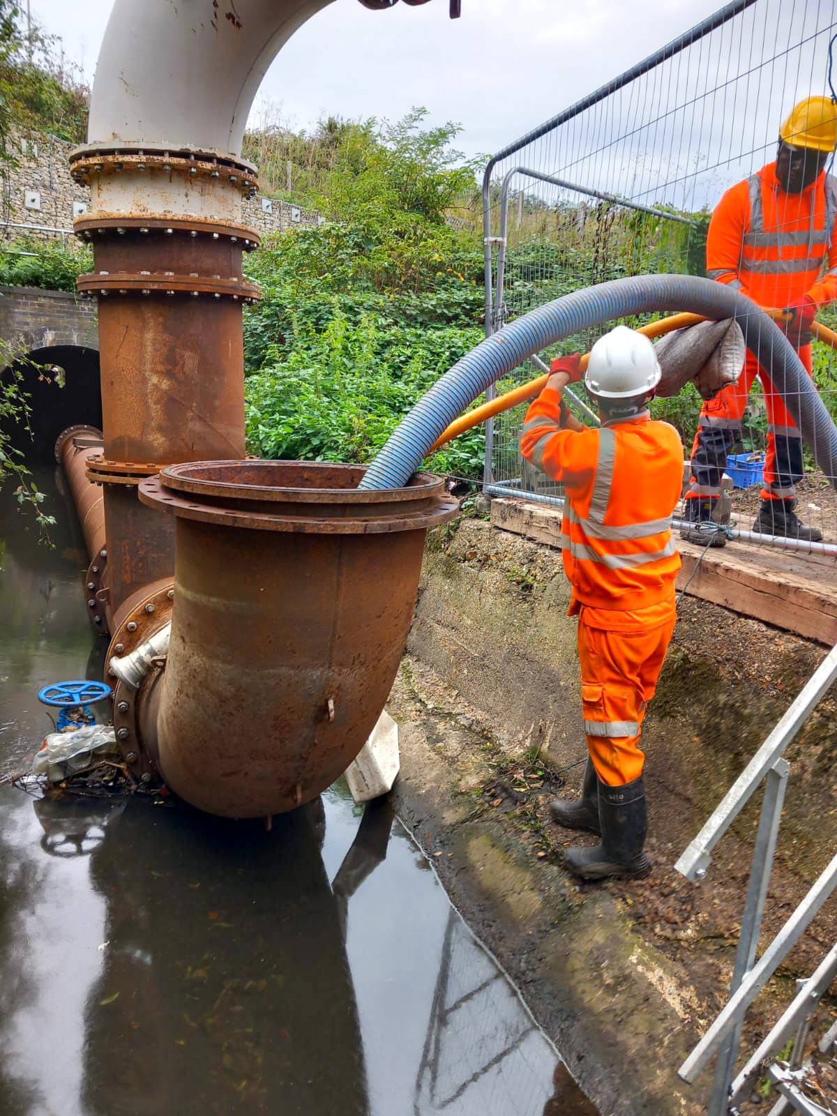 Engineer reviewing CCTV footage during survey